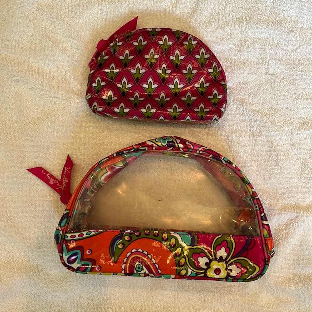 2 Vera Bradley travel cases.